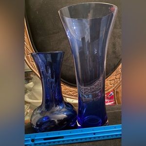 Two Blue glass flower vases.